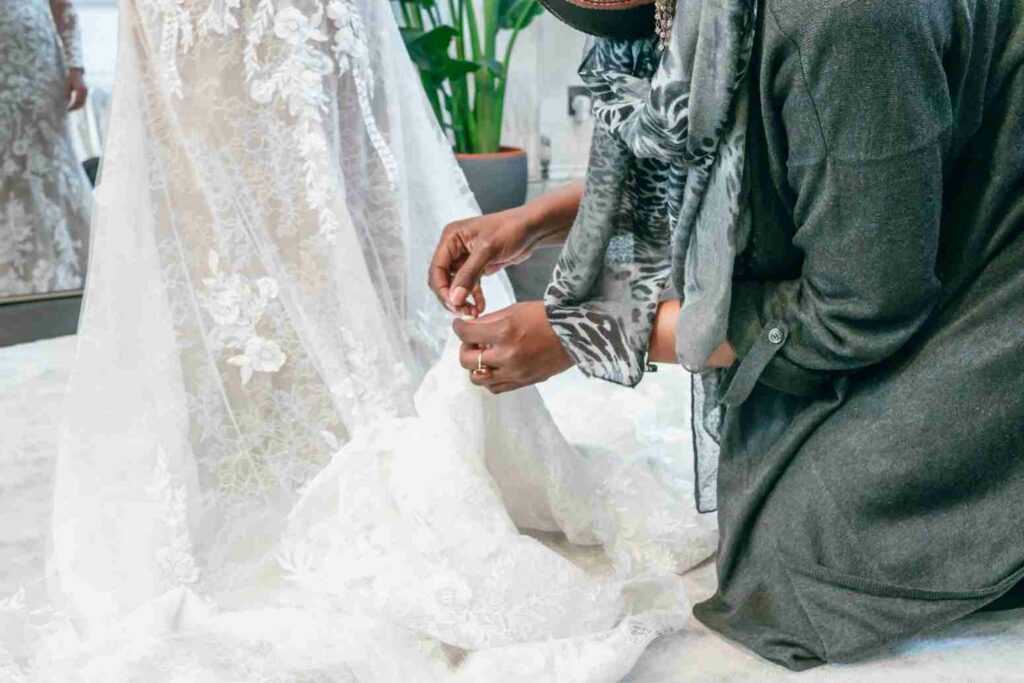 Adding a bustle to a wedding dress in our bridal boutique in London