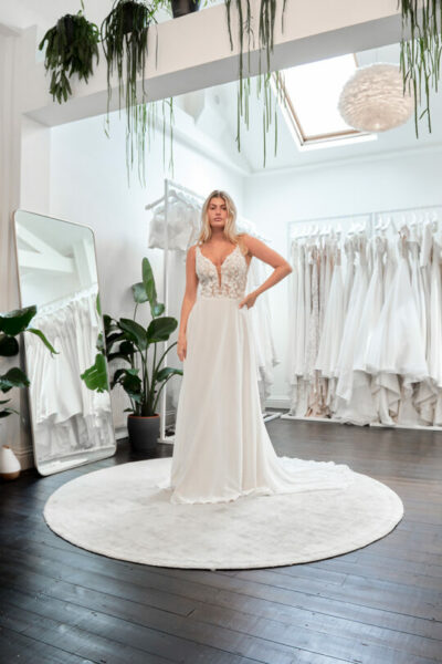Evelie bride trying on a wedding dress